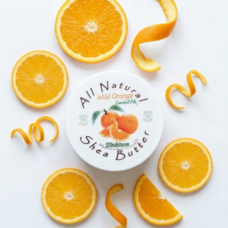 Orange Shea Butter product with sliced oranges and curled orange zest around it