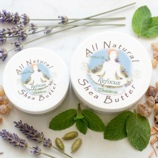 Two containers of All Natural Refocus Shea Butter with lavender, mint, and other botanicals on a white background.