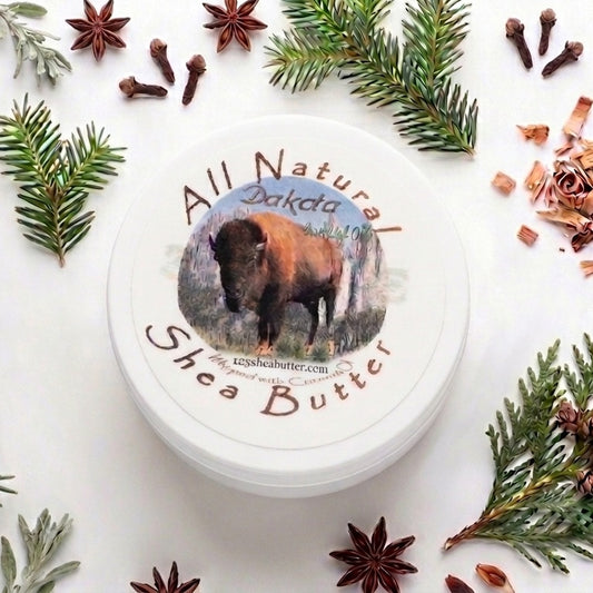 Jar of All Natural Dakota Shea Butter surrounded by decorative elements on a white background