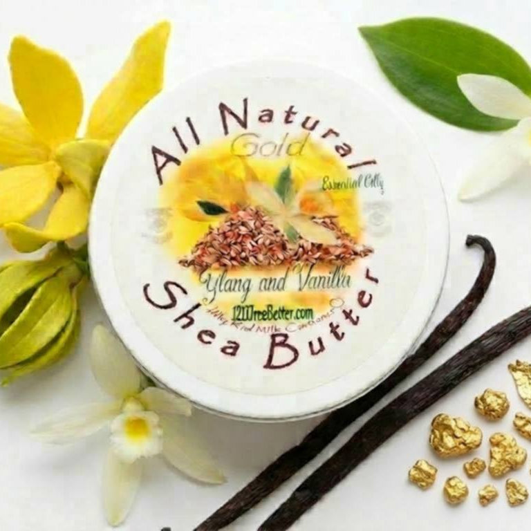Jar of All Natural Gold Ylang Ylang and Vanilla Shea Butter with vanilla beans and flowers on a white background