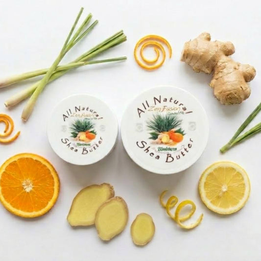 Two containers of Zen Fusion All Natural shea butter with ginger, lemon, and orange on a white background