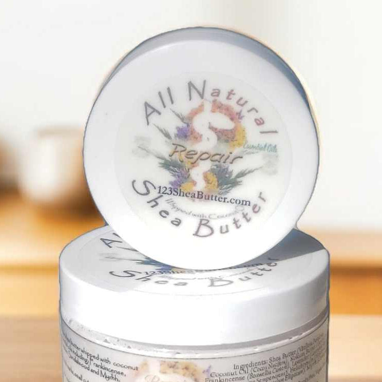 Jar of all natural shea butter  Repair with a lid on a wooden surface